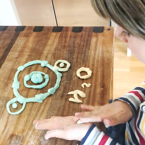 Making a water molecule with playdough